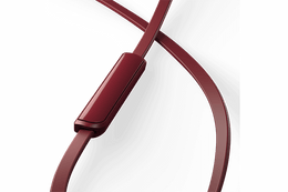 TCL MTRO100RD Burgundy Crush wired in-ear headphones with microphone close-up of the inline control module with playback and microphone buttons